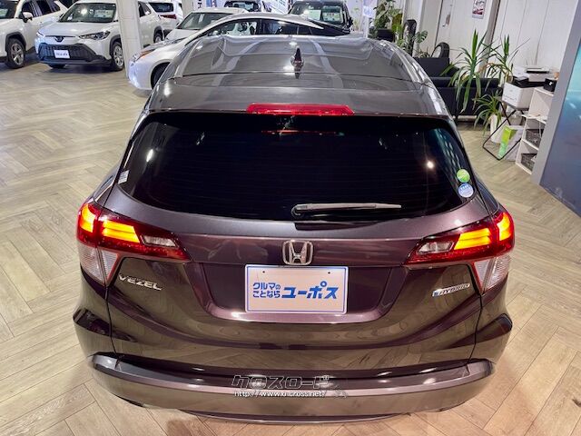 「お問合せはユーポス新都心店まで/098-860-8880お待ちしております」 ホンダ ヴェゼル