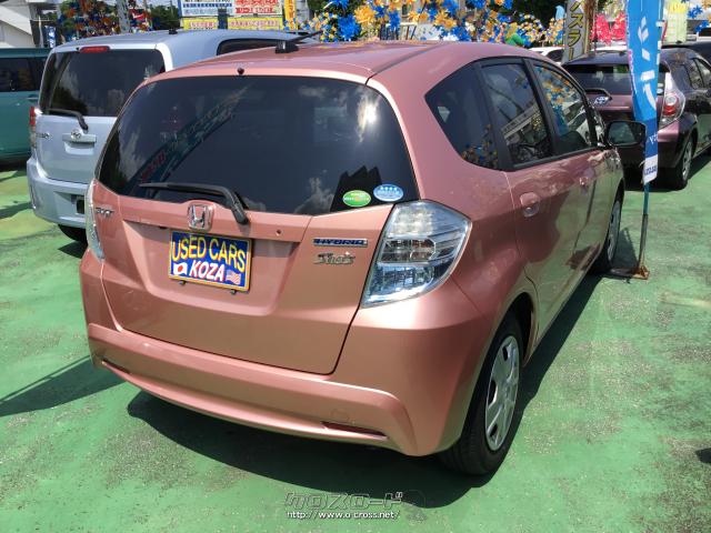 ホンダ フィットハイブリッド シーズイファインスタイル 13 H25 年式 ピンク 1300cc コザ自動車株式会社 4 7万km 保証付 3ヶ月 3千km 沖縄の中古車情報 クロスロード